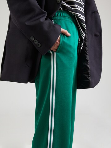 Loosefit Pantaloni di Champion Authentic Athletic Apparel in verde