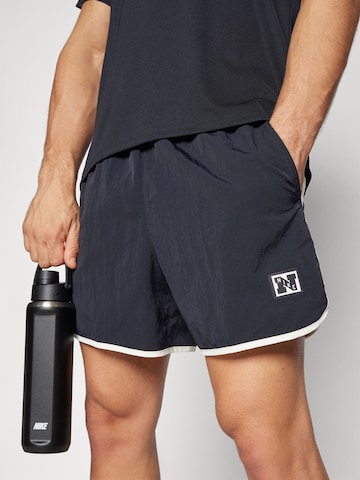 NIKE regular Παντελόνι φόρμας 'HERITAGE' σε μαύρο