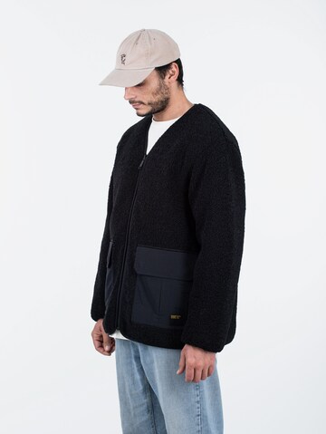 Carhartt WIP Übergangsjacke 'Devin Liner' in Schwarz: Vorderseite