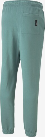 PUMAregular Sportske hlače 'Pivot' - zelena boja