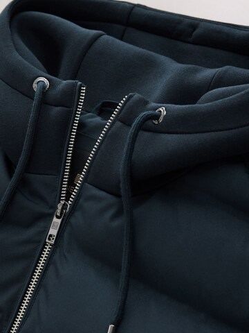 Next Tussenjas in Blauw