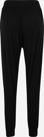 Tapered Pantaloni sportivi di CURARE Yogawear in nero