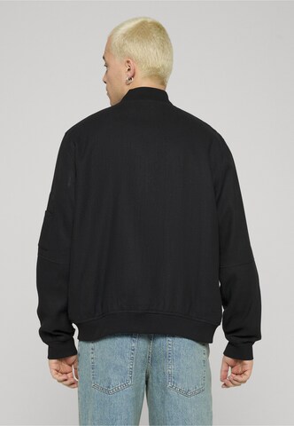 Unfair Athletics Tussenjas in Zwart