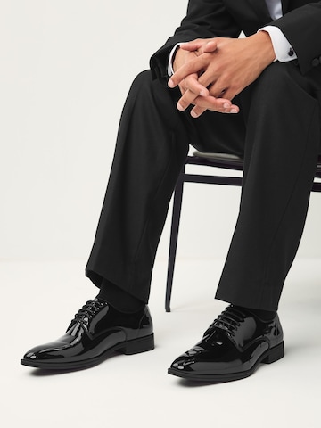 Chaussure à lacets Next en noir