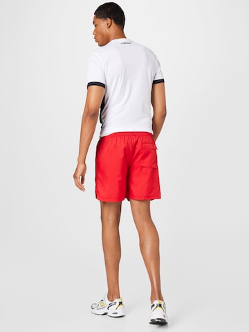 Nike Sportswearregular Hlače 'Essentials' - crvena boja
