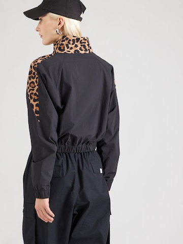 Reebok Tussenjas in Zwart