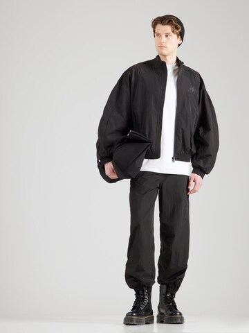 Han Kjøbenhavn Конический (Tapered) Штаны в Черный