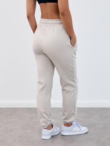 MAKARIĆ Regular Workout Pants in Beige