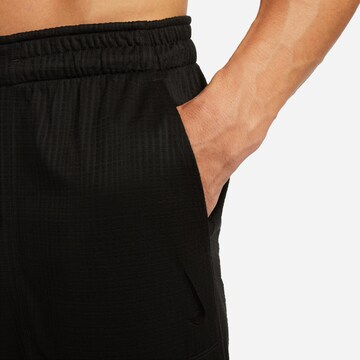 NIKE Tapered Sportbroek in Zwart