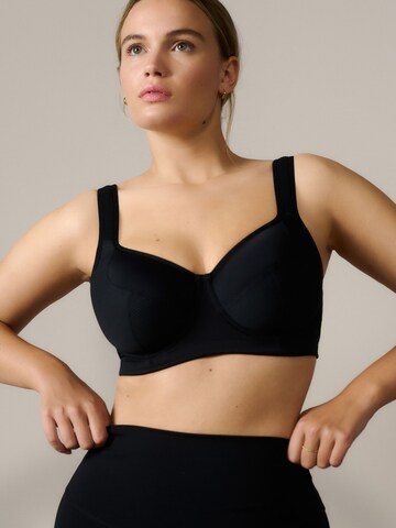 Invisible Soutien-gorge de sport Next en noir : devant