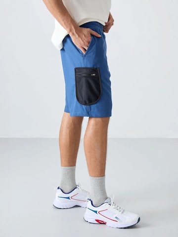 Tommy Life - Perna larga Calças cargo em azul