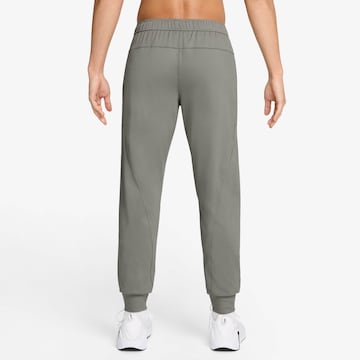 NIKE Tapered Workout Pants in Green