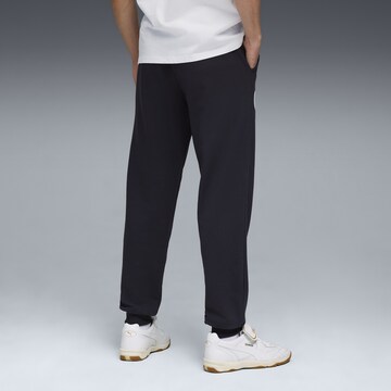 PUMA Tapered Sportbroek in Zwart