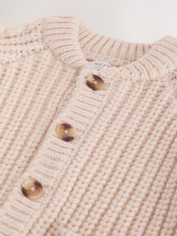 Next Neuletakki värissä beige