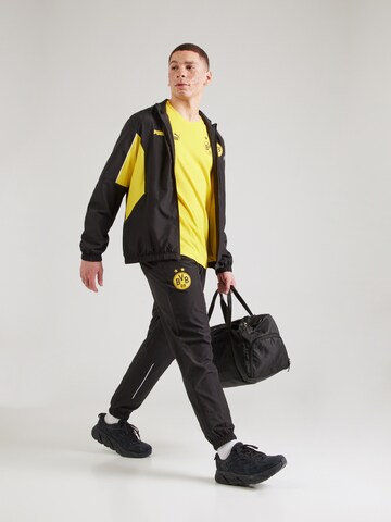 PUMA - Tapered Pantalón deportivo 'Borussia Dortmund FtblArchive' en negro