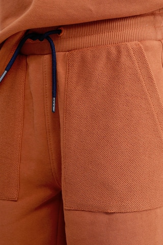 regular Pantaloni di WE Fashion in arancione