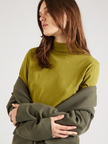 Tricou 'ANCHAL' de la MELAWEAR pe verde