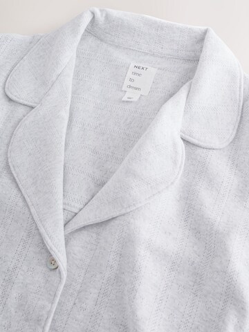 Pijama de la Next pe gri