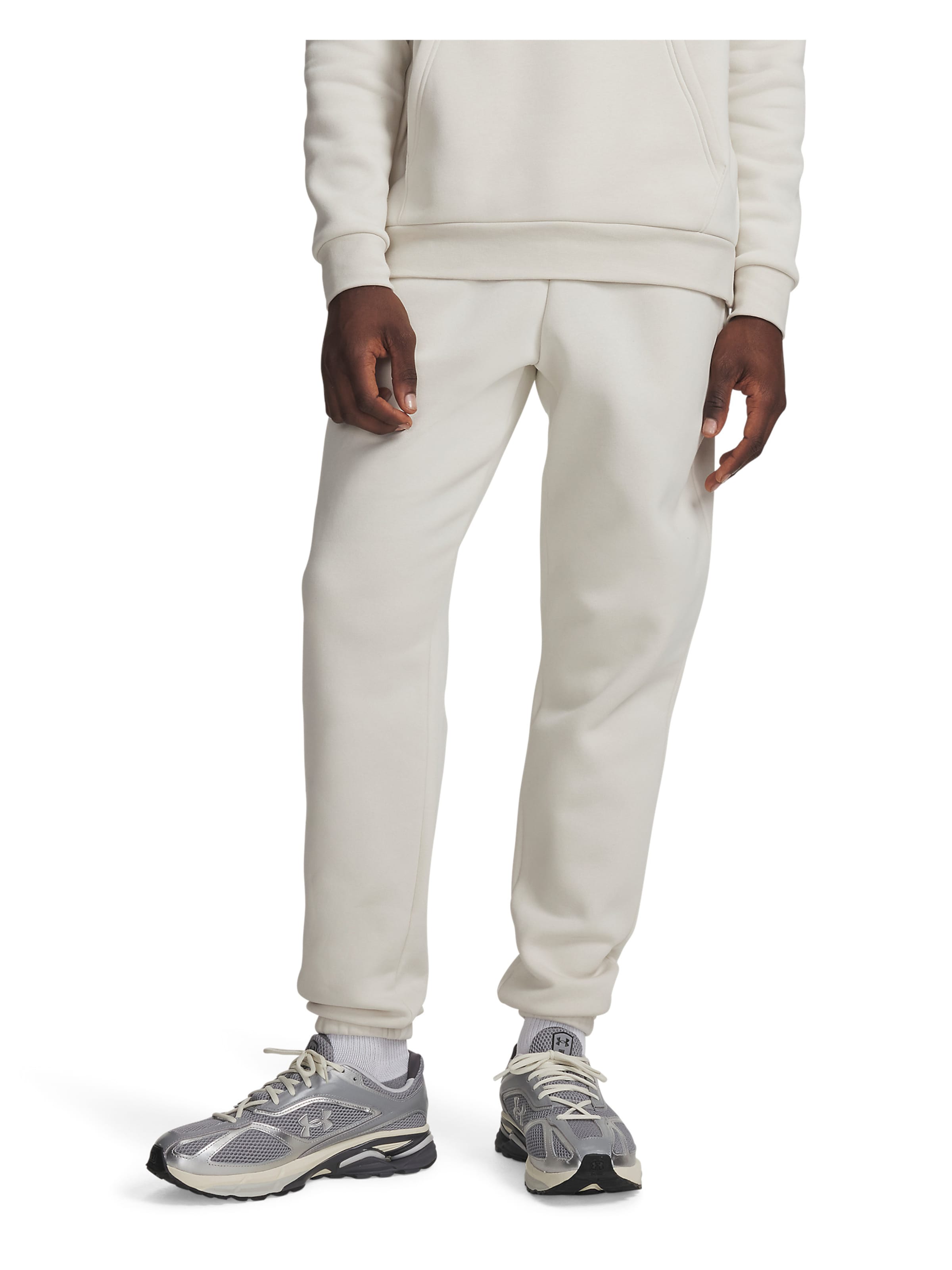 UNDER ARMOUR Tapered Workout Pants in White: front
