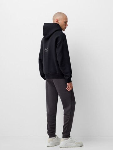 Bershka Tapered Bukser i grå