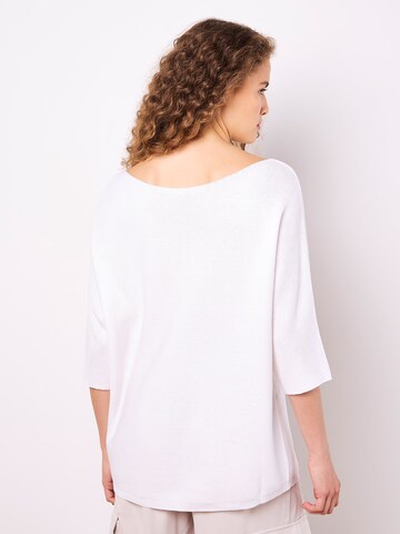 Pull-over ' ' Apricot en blanc