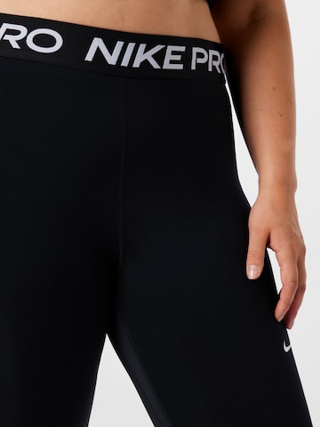 Skinny Pantalon de sport NIKE en noir