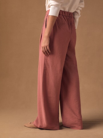 Next Široke hlačnice Hlače | roza barva