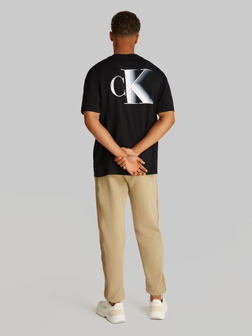 Calvin Klein Jeans - Camiseta en negro: frente