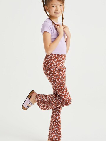 WE Fashion Rozkloszowany krój Legginsy w kolorze pomarańczowy