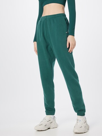 aim'n - Tapered Pantalón deportivo en verde: frente