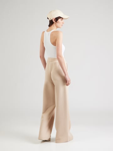 EA7 Emporio Armani Zvonové kalhoty Kalhoty – béžová