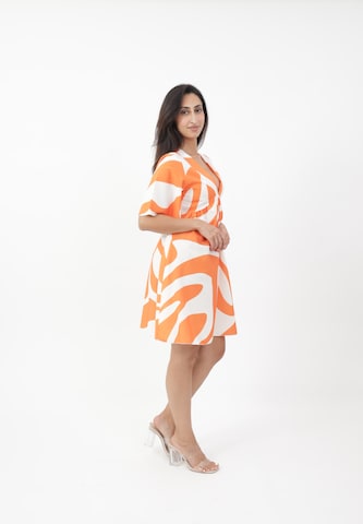 Elara Kjole i orange