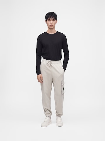 balta Calvin Klein Jeans Siaurėjantis Laisvo stiliaus kelnės