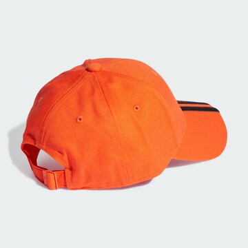ADIDAS ORIGINALS Caps i oransje