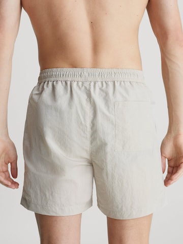 Shorts de bain Calvin Klein Swimwear en beige