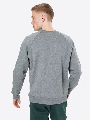 UNDER ARMOUR - Sweatshirt de desporto 'Rival' em cinzento