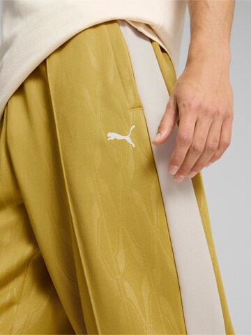 PUMA Regular Sporthose ' The NeverWorn IV T7' in Gelb