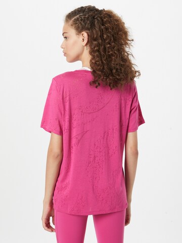 Reebok - Camiseta funcional en rosa
