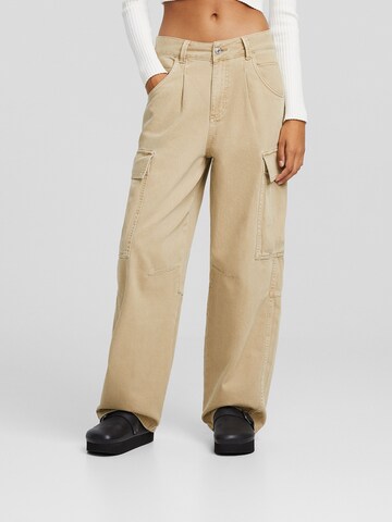 Bershka Zvonové kalhoty Džíny s kapsami – béžová: přední strana