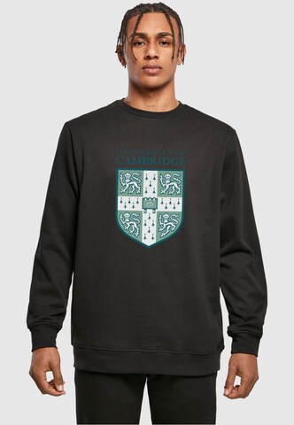 Merchcode Sweatshirt 'University Of Cambridge - Shield' in Zwart: voorkant