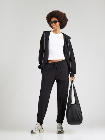 Effilé Pantalon Reebok en noir
