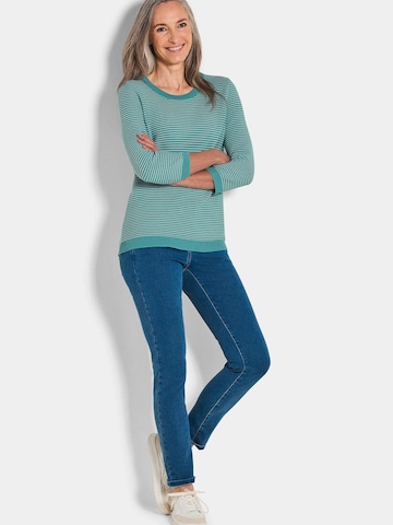 Goldner Pullover in Grün