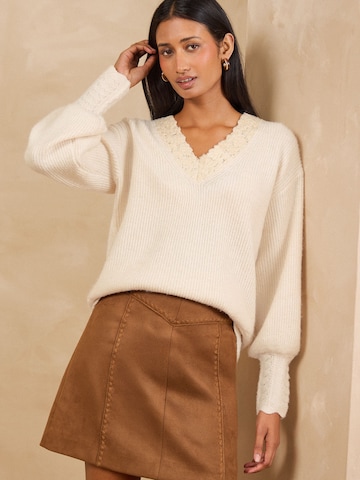 Pull-over love & roses en beige
