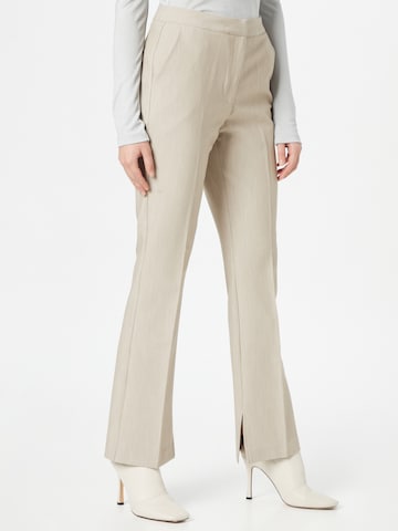 Another Label Flared Pleated Pants 'Nore' in Beige: front