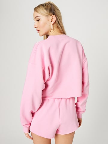 Hoermanseder x About You Sweatshirt 'Tessy' in Pink