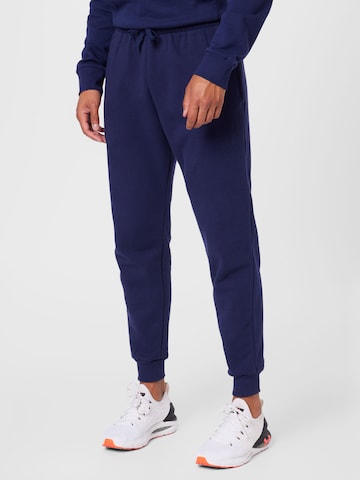 Effilé Pantalon de sport UNDER ARMOUR en bleu : devant