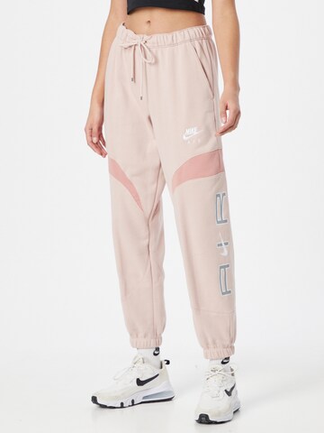 Nike Sportswear Tapered Pants in Pink: front