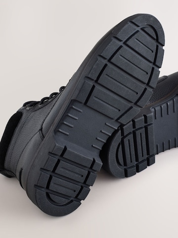 Next - Botas con cordones en negro