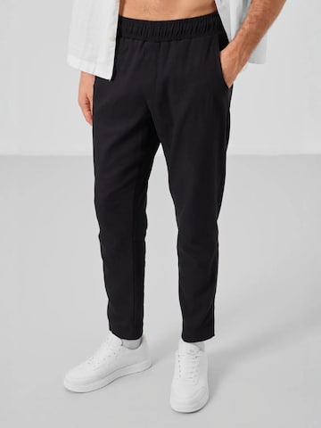 Pantaloni di Tommy Life in nero: frontale