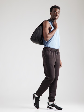 Tapered Pantaloni sport de la PUMA pe negru